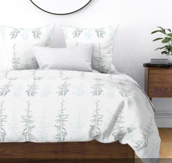 Pines against the snow duvet cover