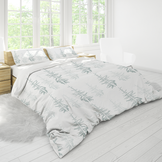 Pines against the snow duvet cover
