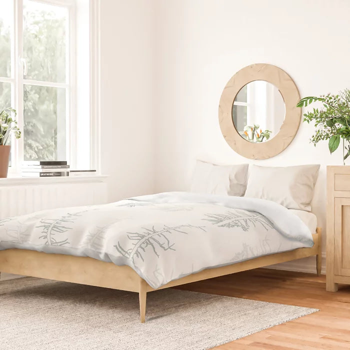 Pines against the snow duvet cover