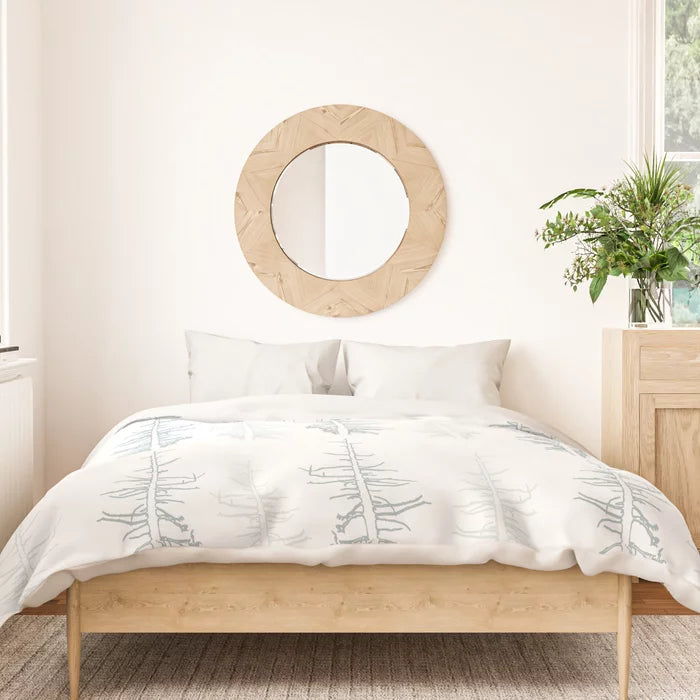 Pines against the snow duvet cover
