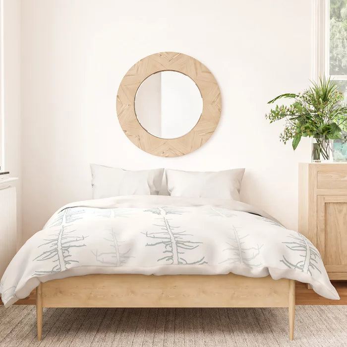 Pines against the snow duvet cover