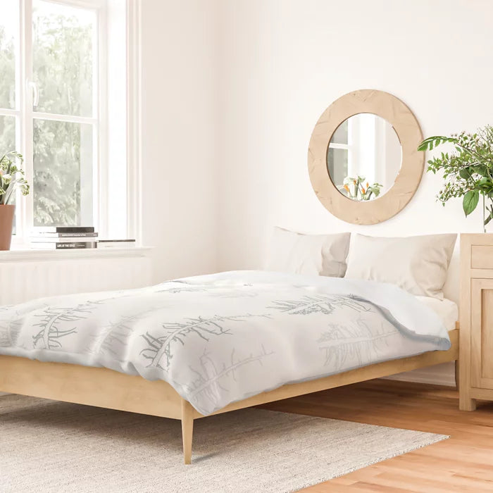 Pines against the snow duvet cover