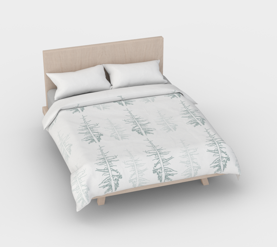 Pines against the snow duvet cover