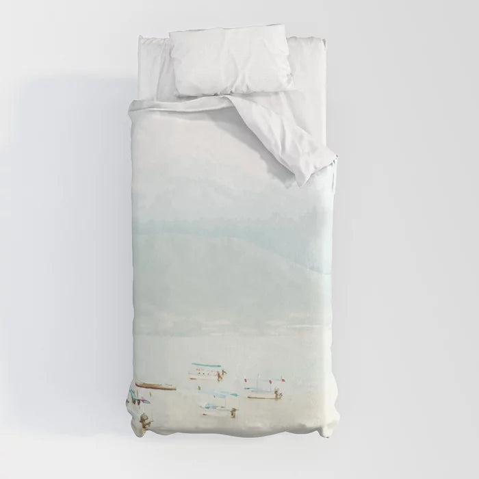 Colorful boats on a pale lake duvet