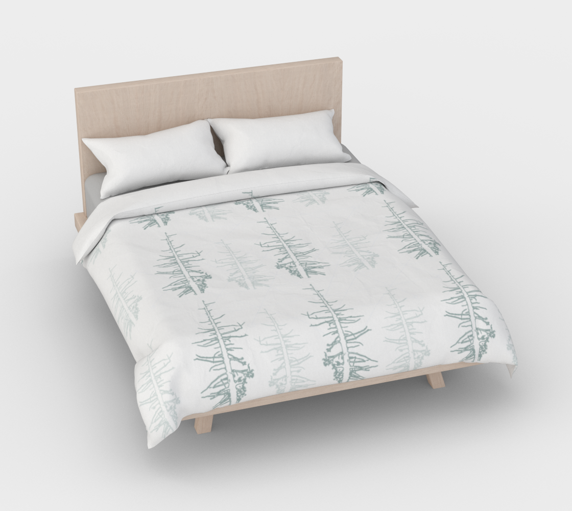 Pines against the snow duvet cover