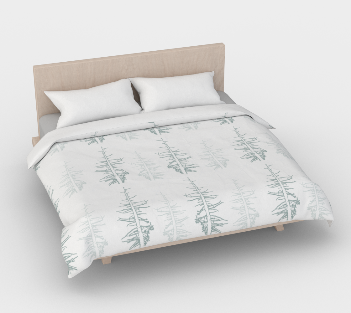 Pines against the snow duvet cover